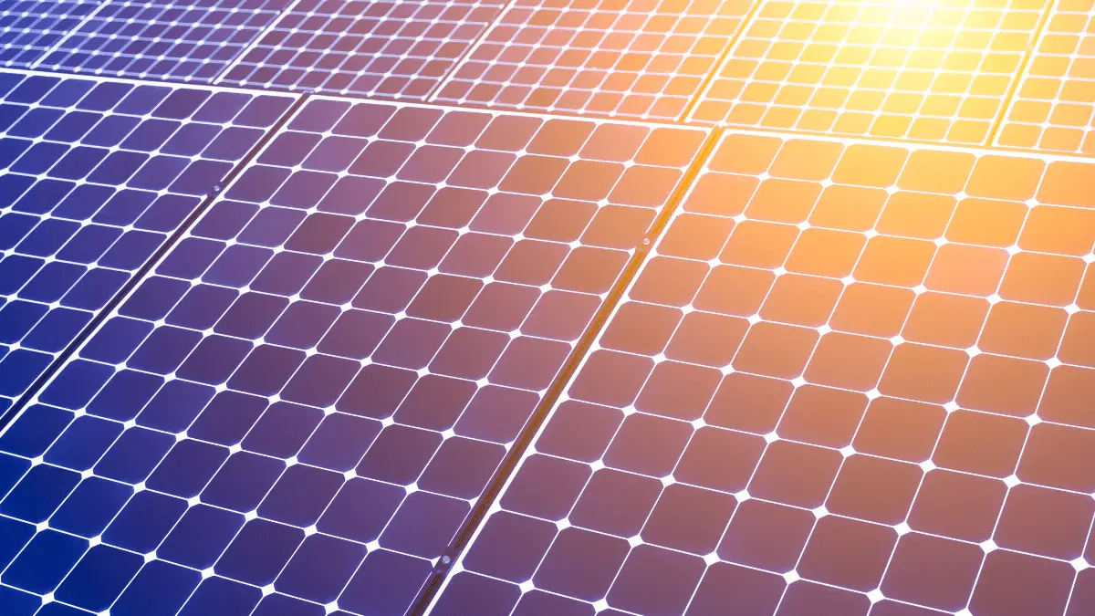 sun shines on solar panel surface