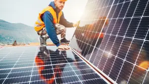 engineer installs solar energy system