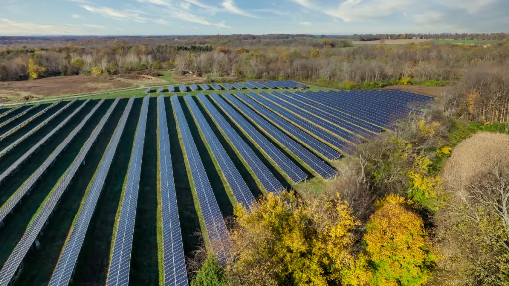 solar farm with the sun shining