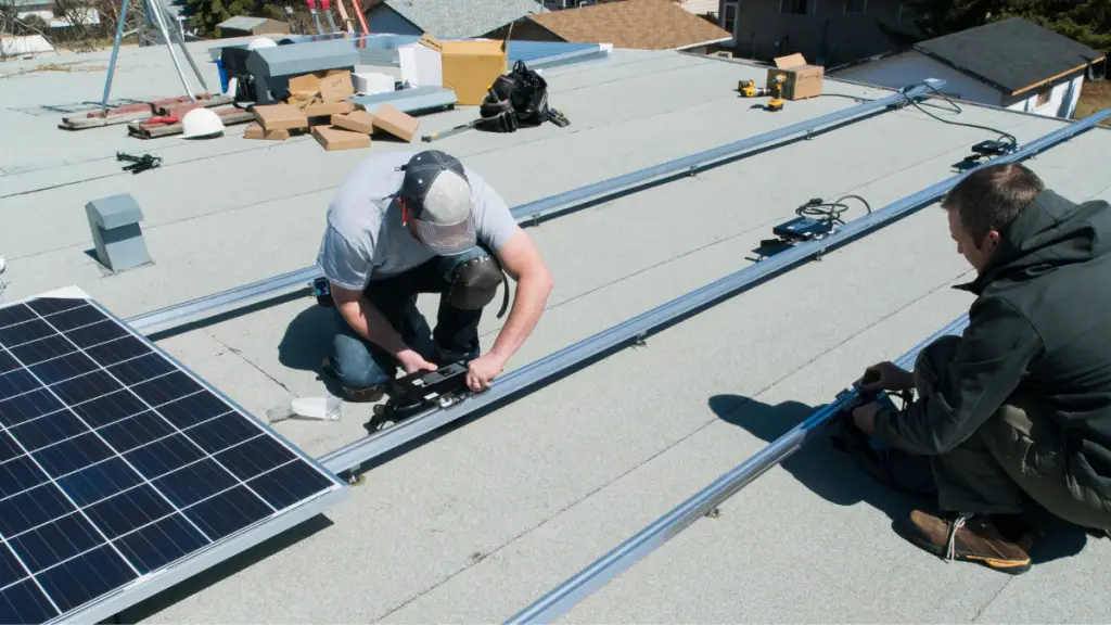 two men do solar installation